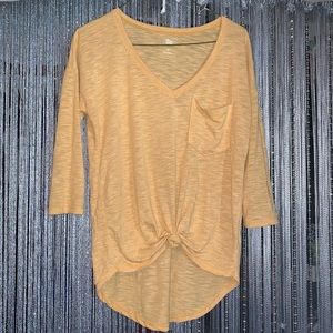 Yellow half sleeve shirt that covers the bum